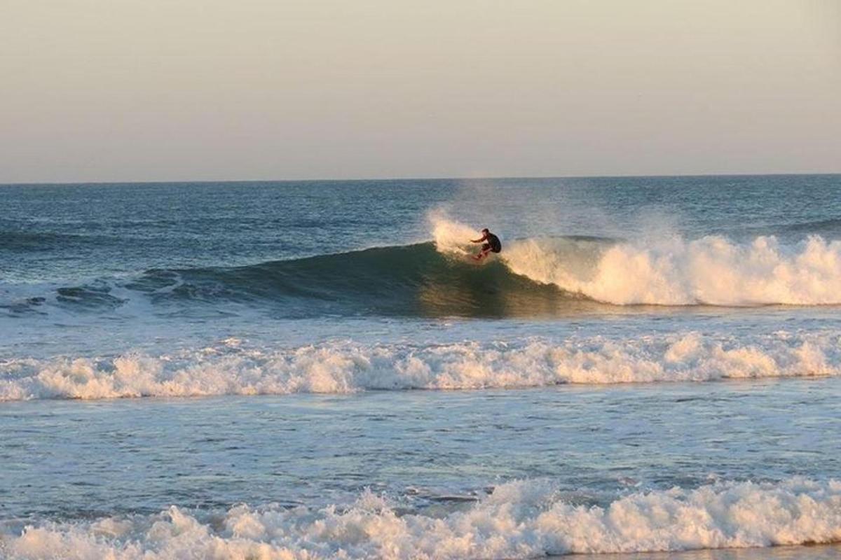 a person riding a wave on a surfboard in the ocean