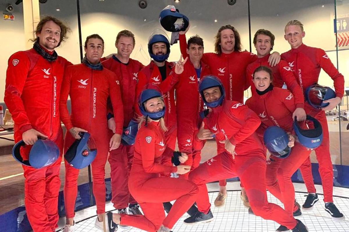 a group of people in red suits posing for a picture