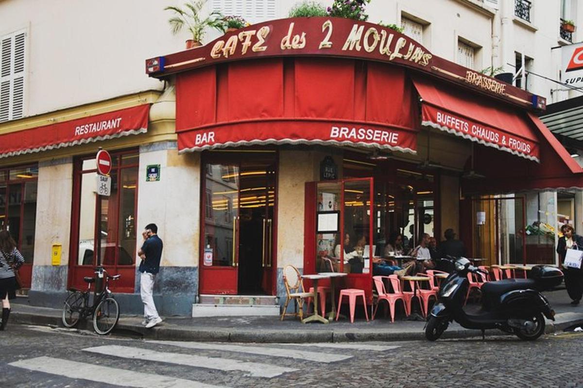 muž stojící před restaurací na ulici