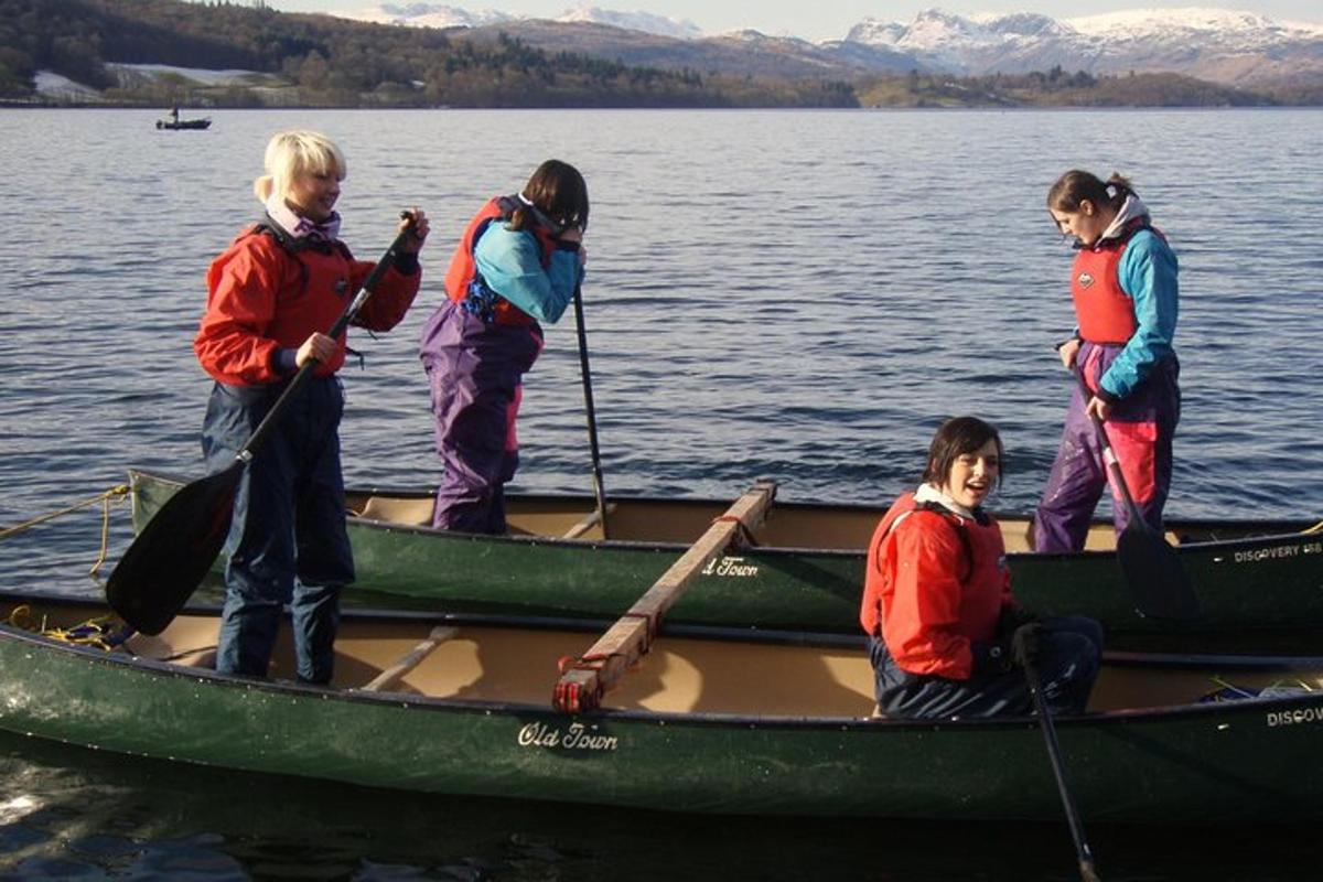 a group of people in a canoe on the water