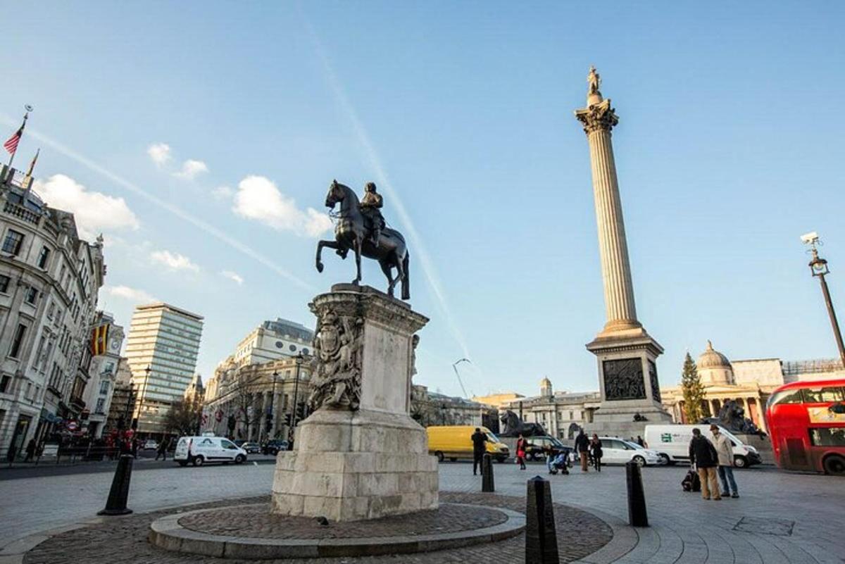 a statue of a man riding a horse in a city