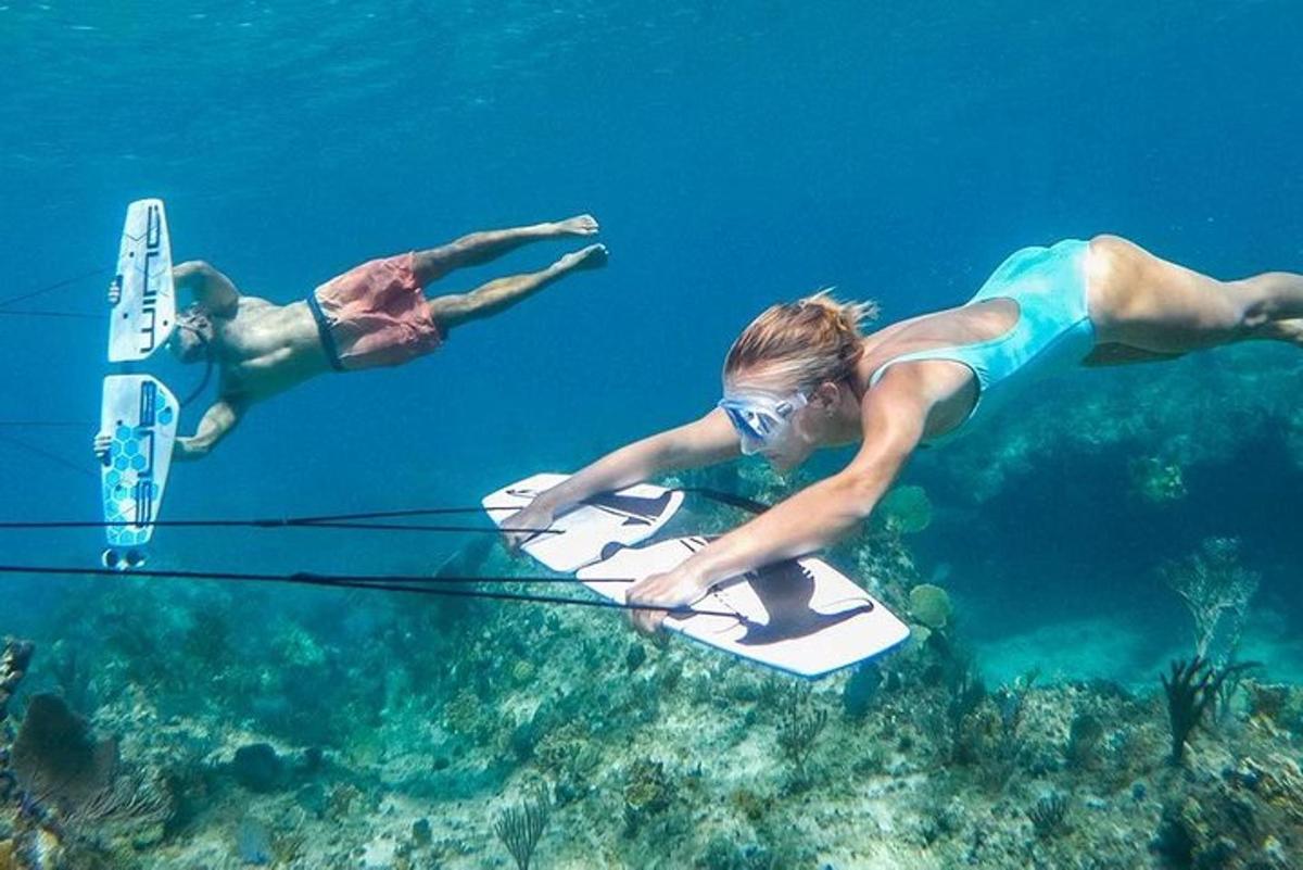 two people on a surfboard in the water