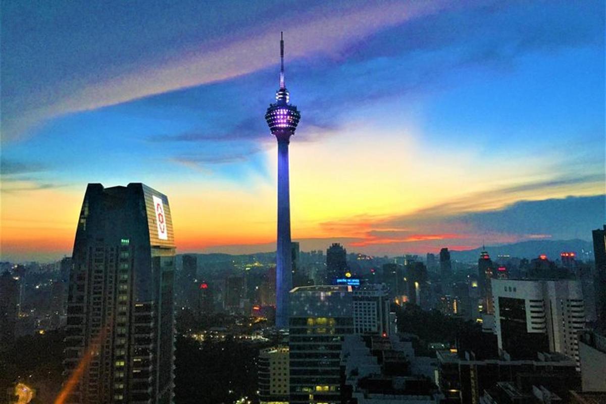 a view of a city skyline with a tall tower