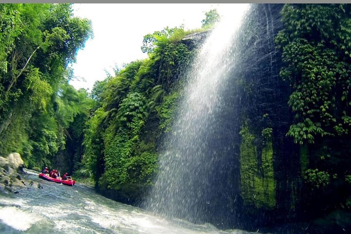a group of people on a boat in a waterfall