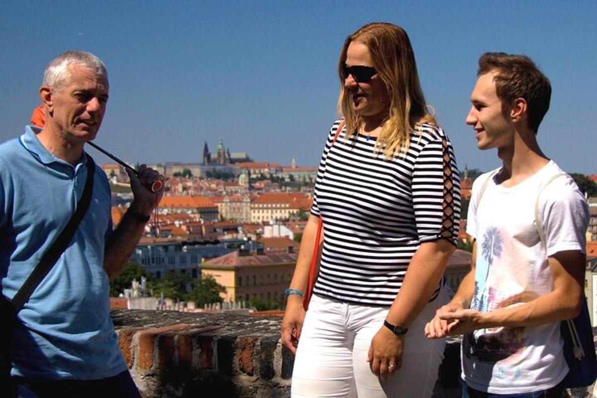 a group of three people standing on top of a wall