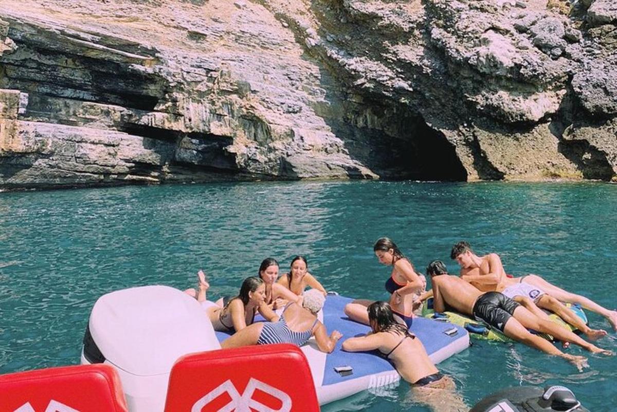 a group of people on a raft in the water