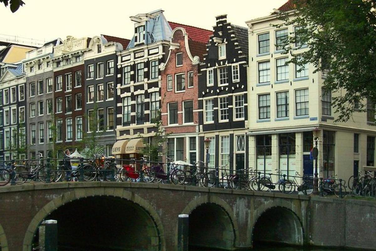 a bridge over a river with bikes on it