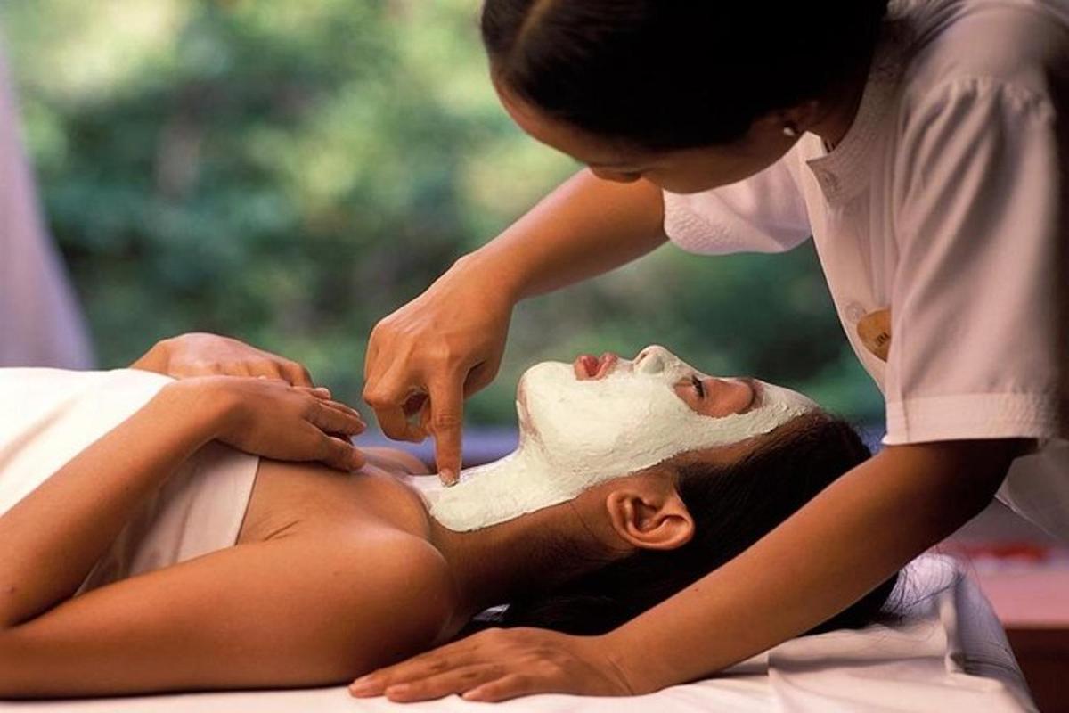 a woman giving a woman a facial massage