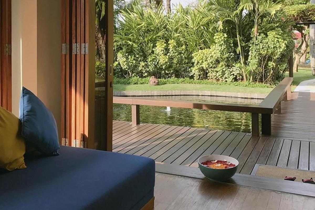 a room with a bowl of food on a wooden deck