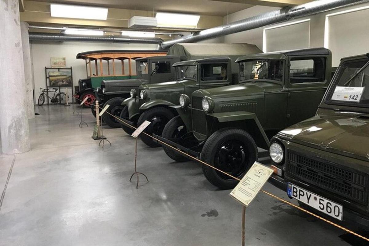 a group of old trucks parked in a garage