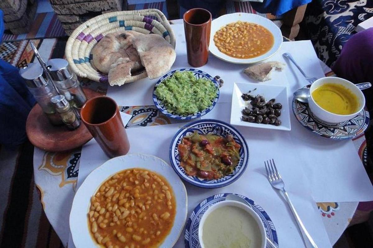 a table with plates of food and bowls of food