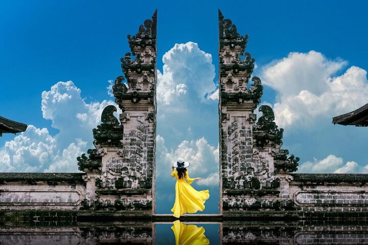 a woman in a yellow dress standing in front of a building