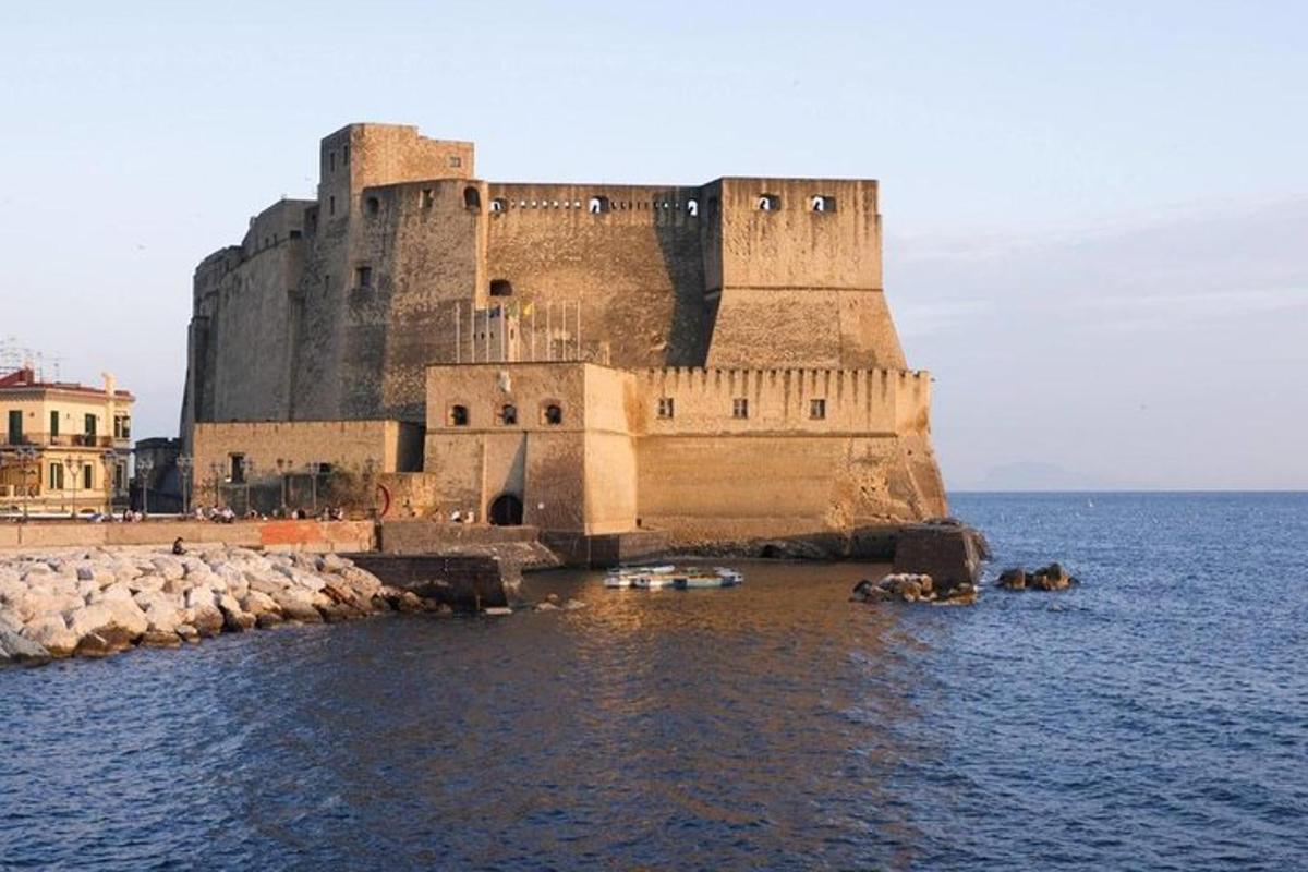 a castle in the water with boats in the water