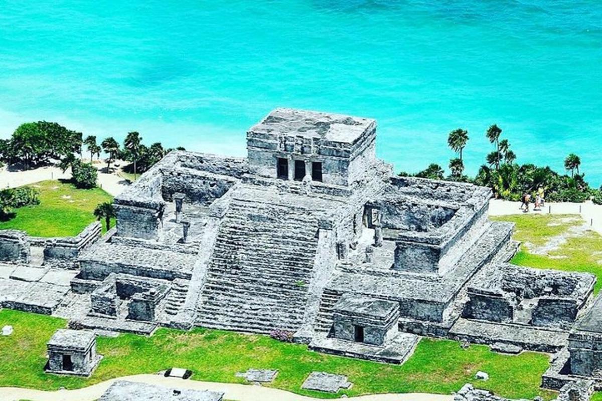 an ancient temple on the beach near the ocean