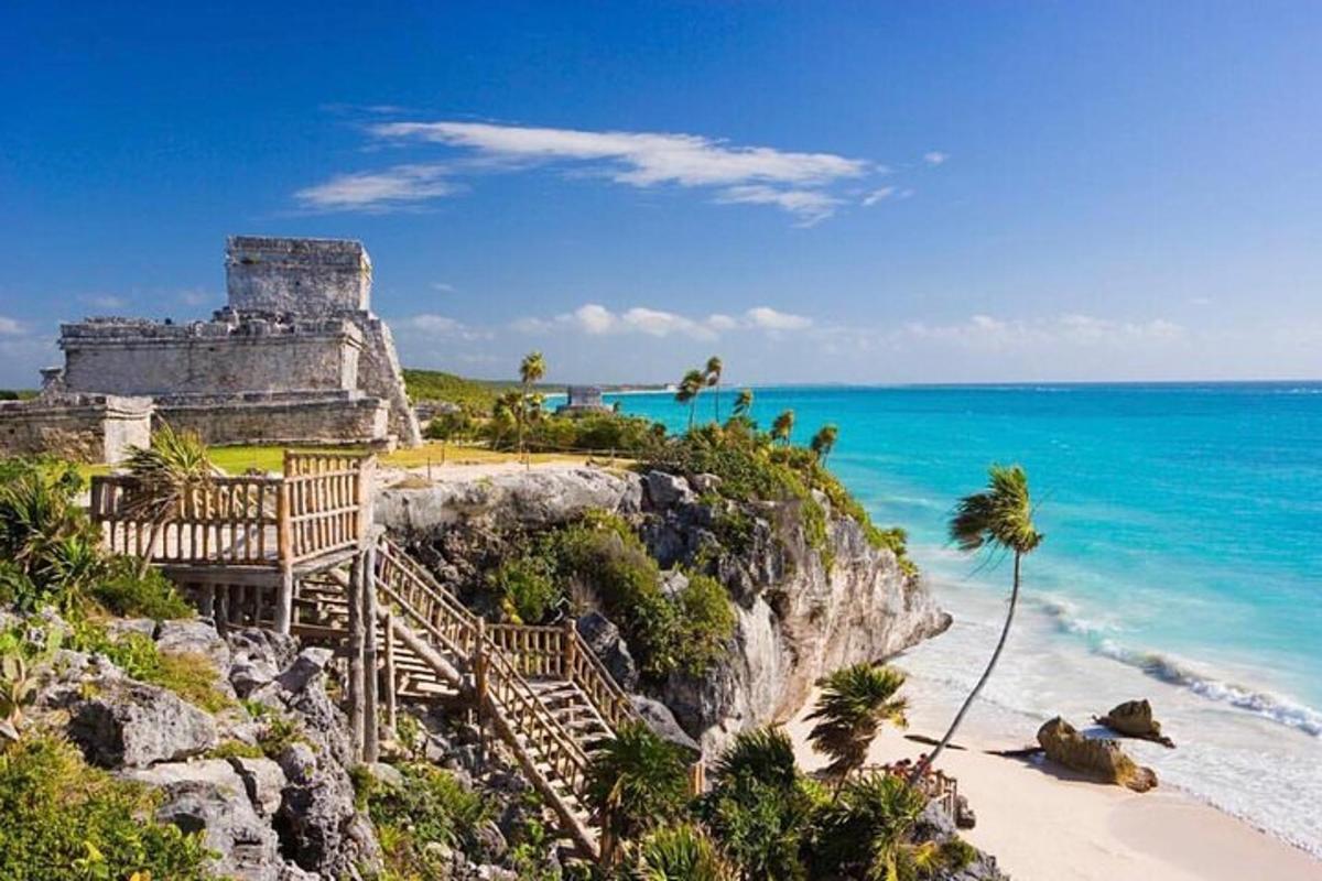 a building on a cliff next to the ocean