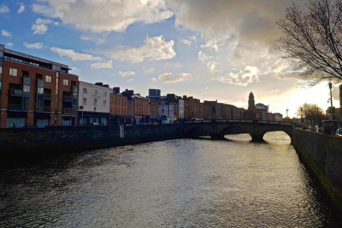 a bridge over a river in a city with buildings