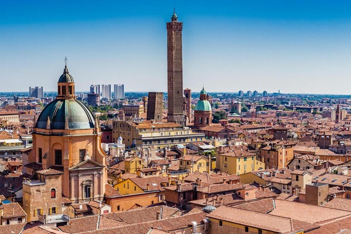 an aerial view of a city with a tall tower