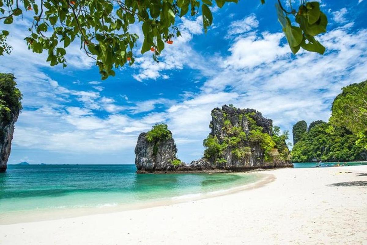 a beach in the philippines with limestone cliffs