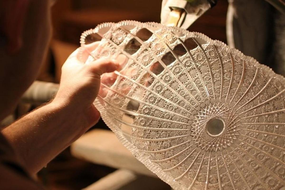 a person is holding a glass fan