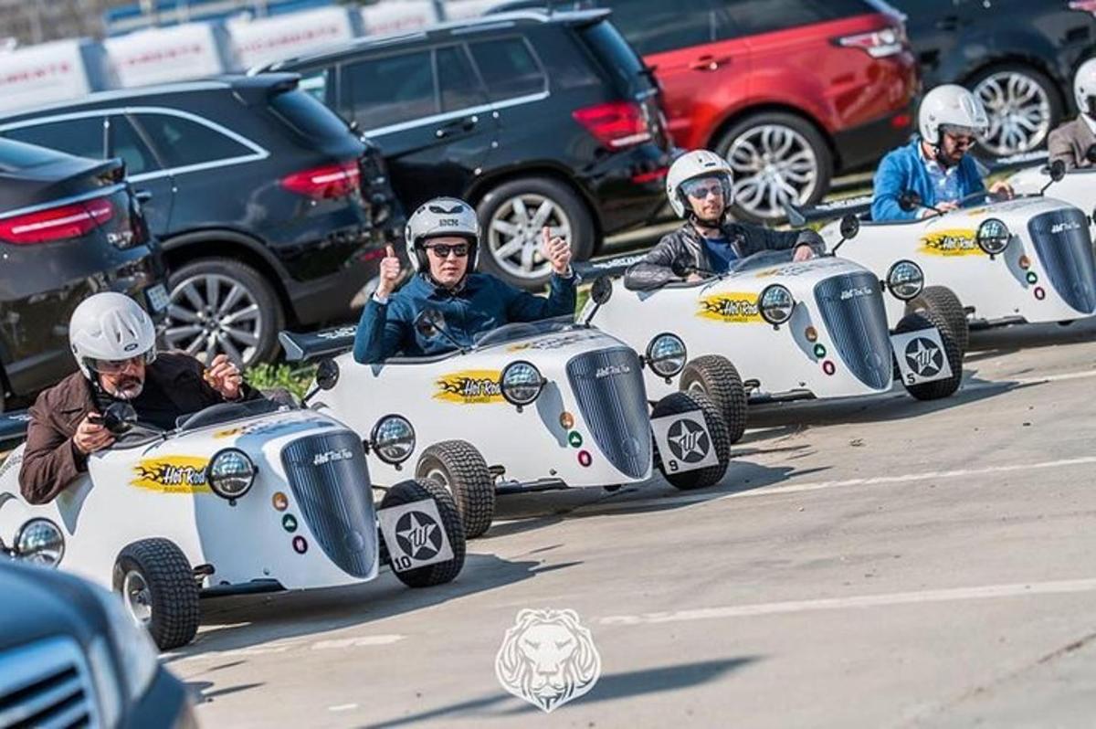 a group of people riding in four wheeler cars