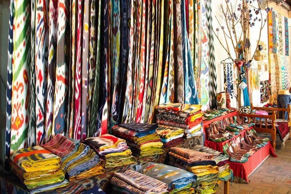 a room with a bunch of colorful blankets and pillows