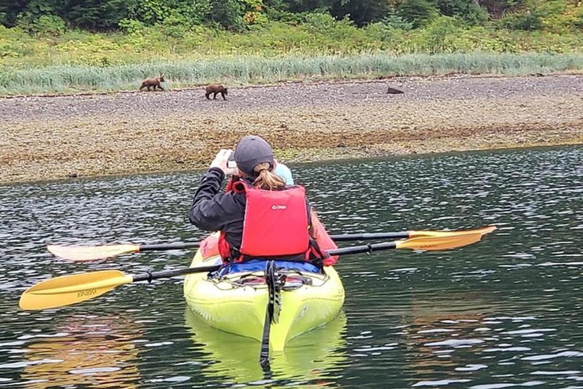 a woman in a kayak in the water