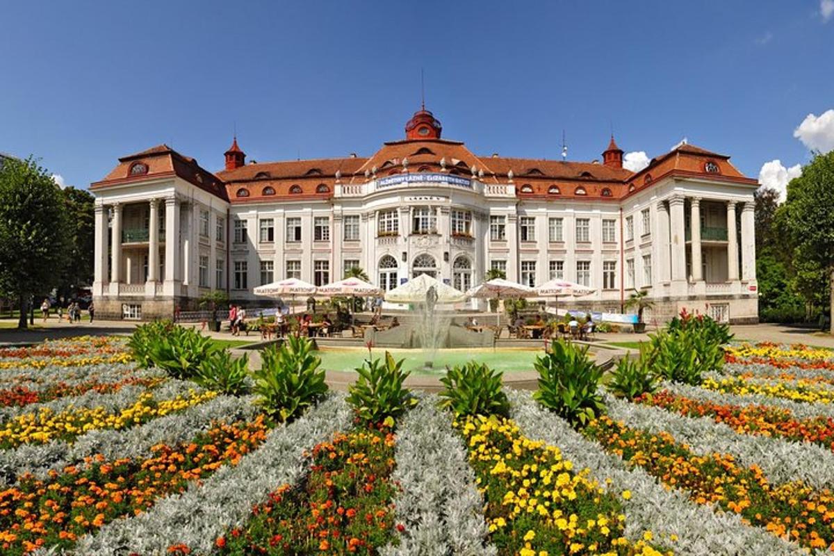 a large building with a garden in front of it