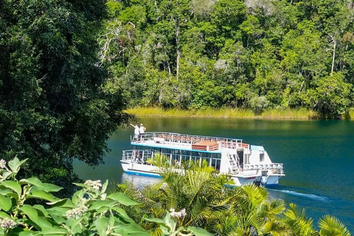 a white boat on a river in the water