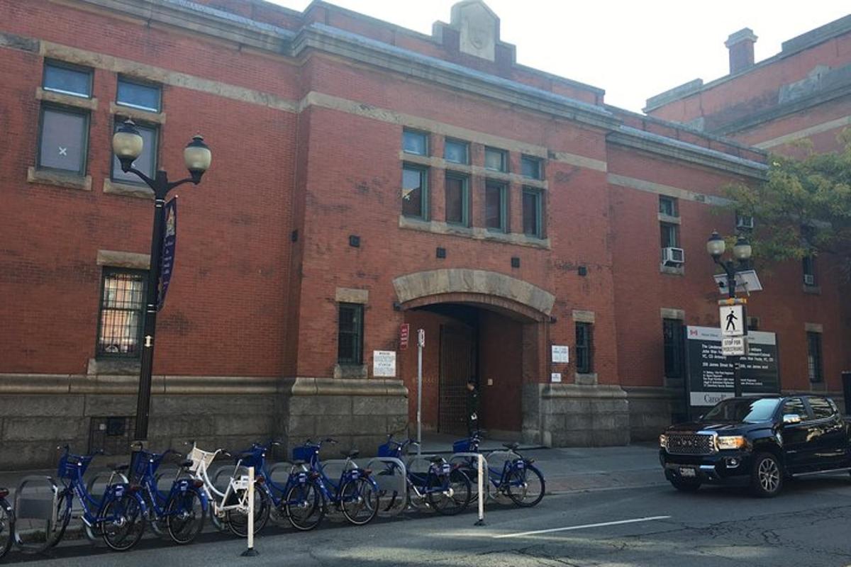 a group of bikes parked in front of a brick building