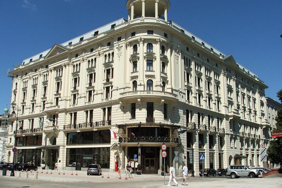 a large white building on the corner of a street