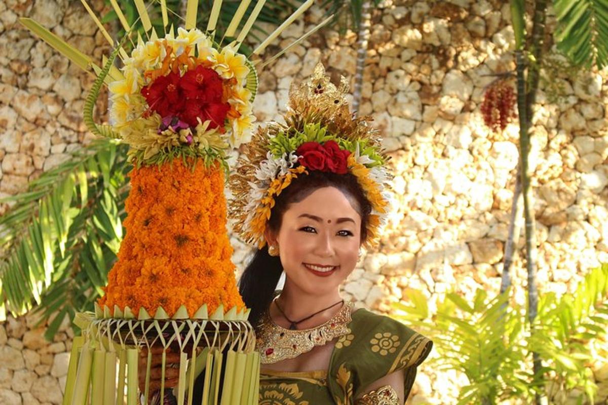 a woman is standing next to a display of flowers