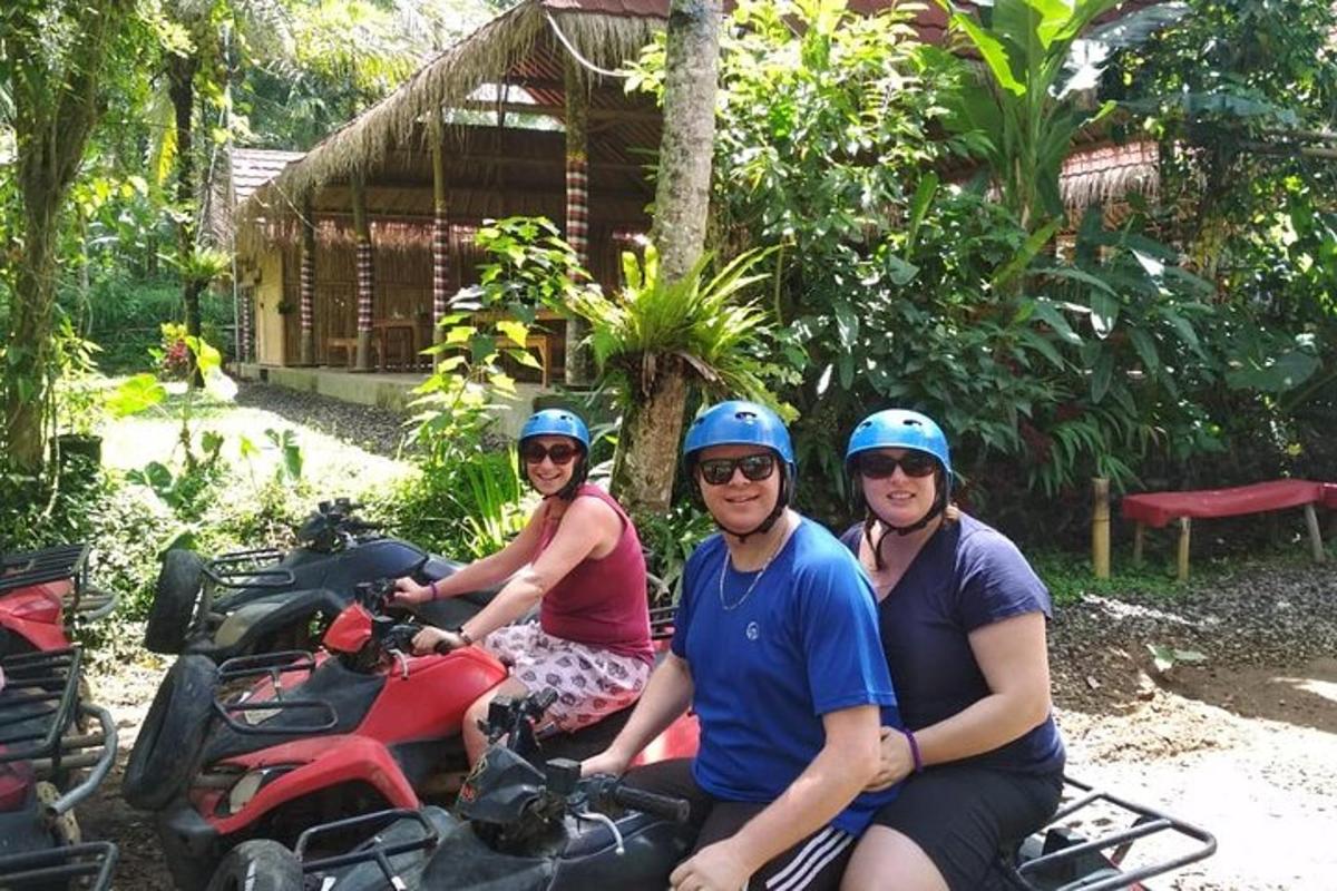 a group of people sitting on a motorcycle