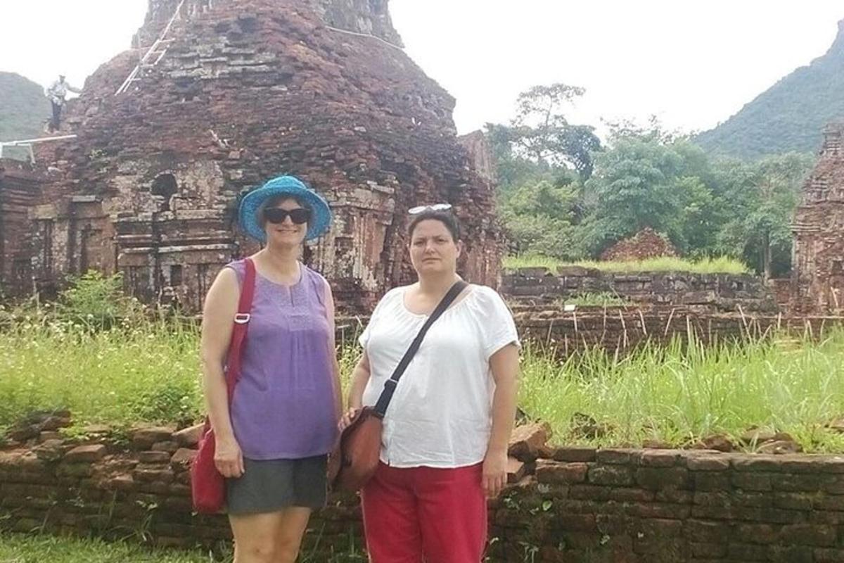 two women standing in front of a building