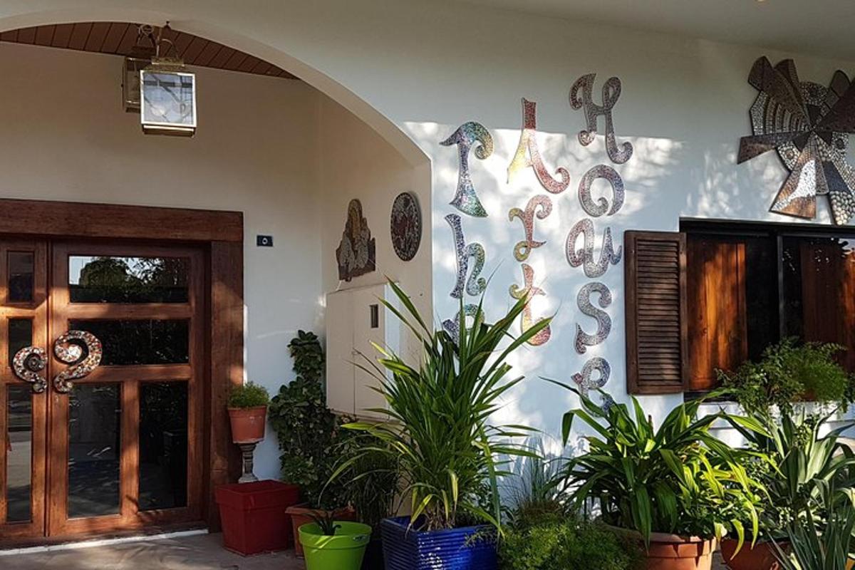 a room with plants and decorations on the wall