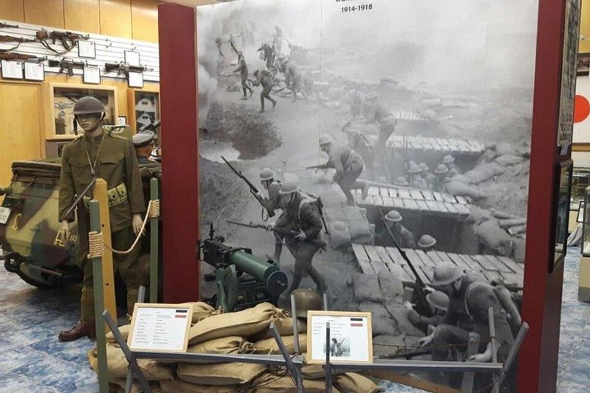 a painting of a soldier and a tank in a museum