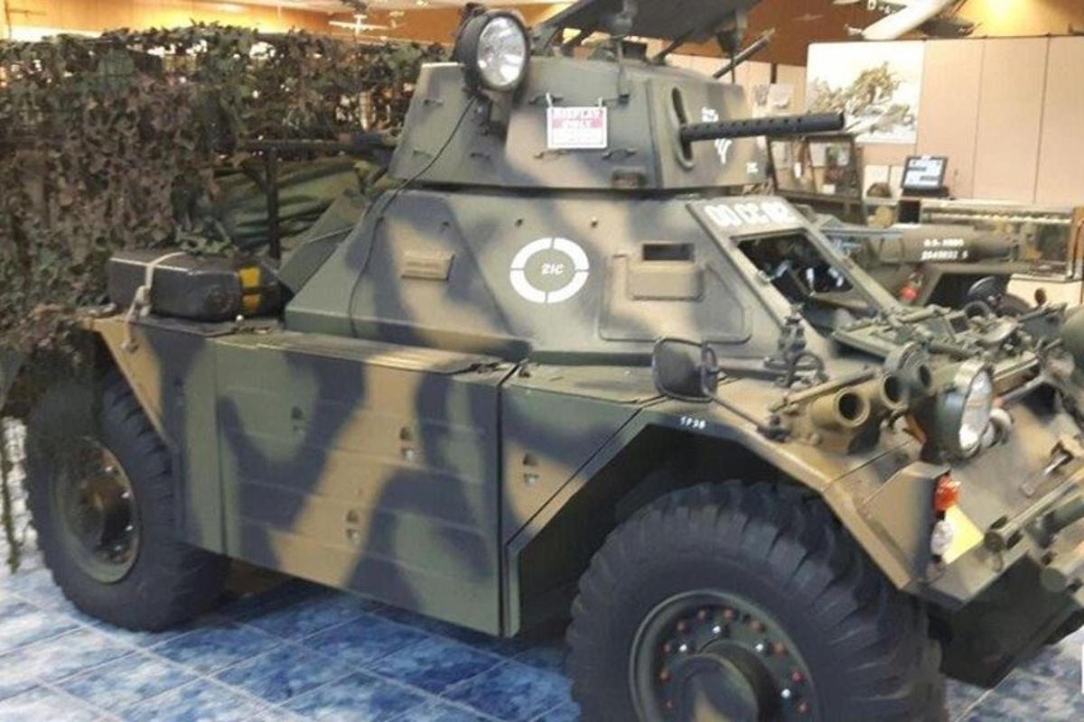 a military vehicle is on display in a museum