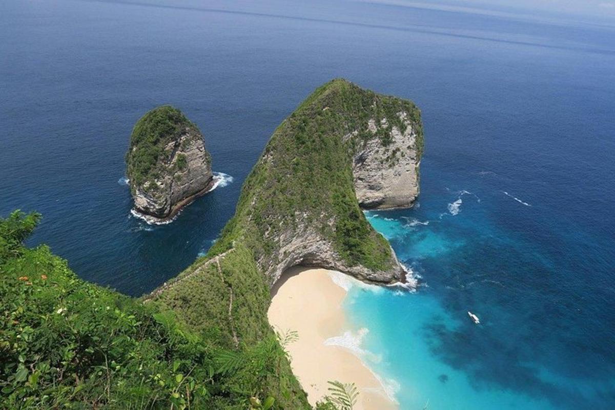 an island with two large rocks in the ocean