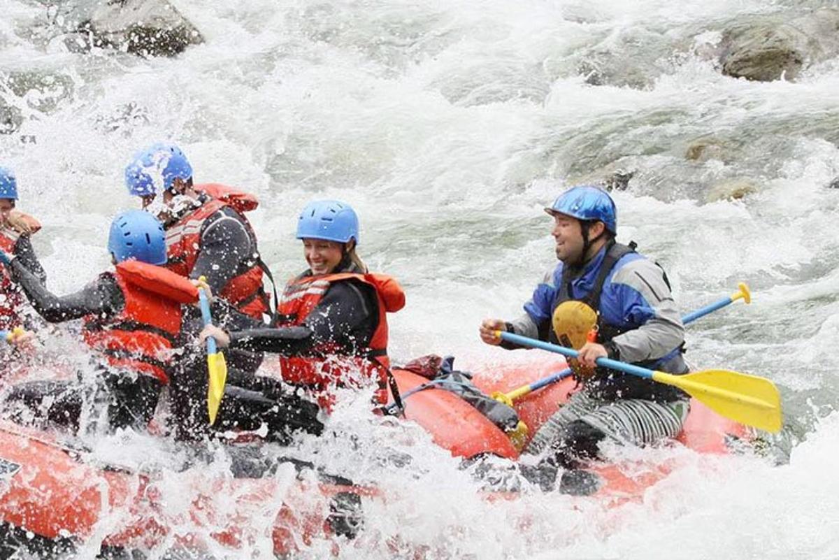 a group of people rafting in a river
