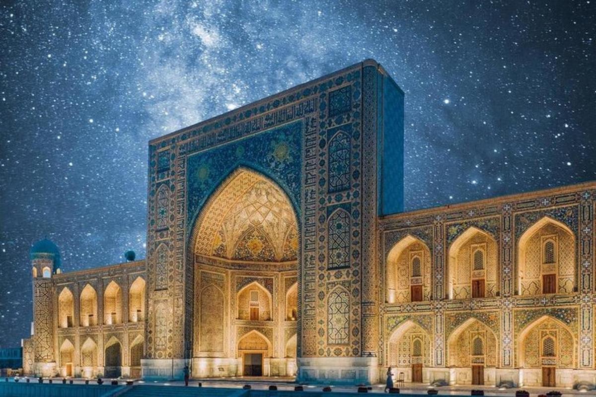 a large building with a sky filled with stars
