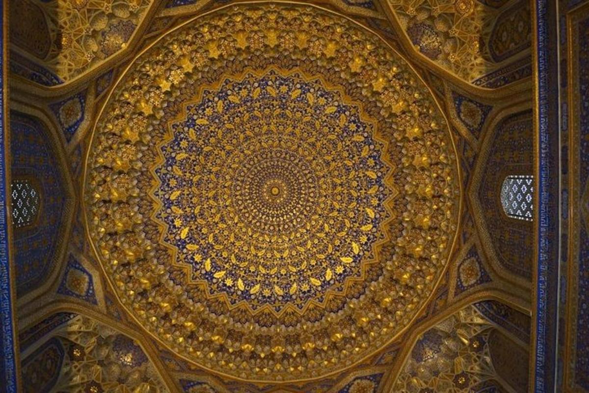 an ornate ceiling of a building with a dome