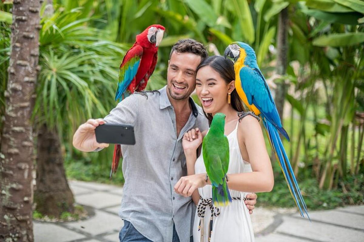 a man and a woman with parrots on their shoulders