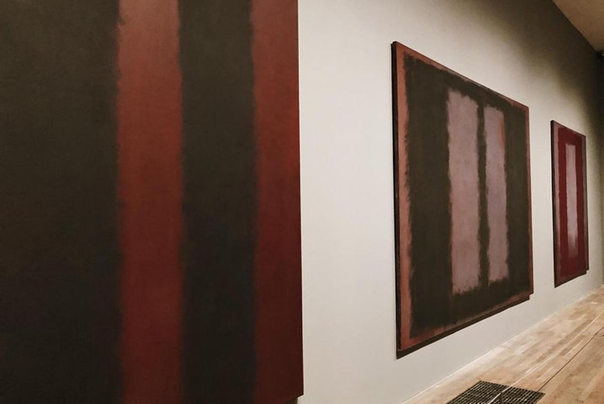 a room with paintings on the walls of a building