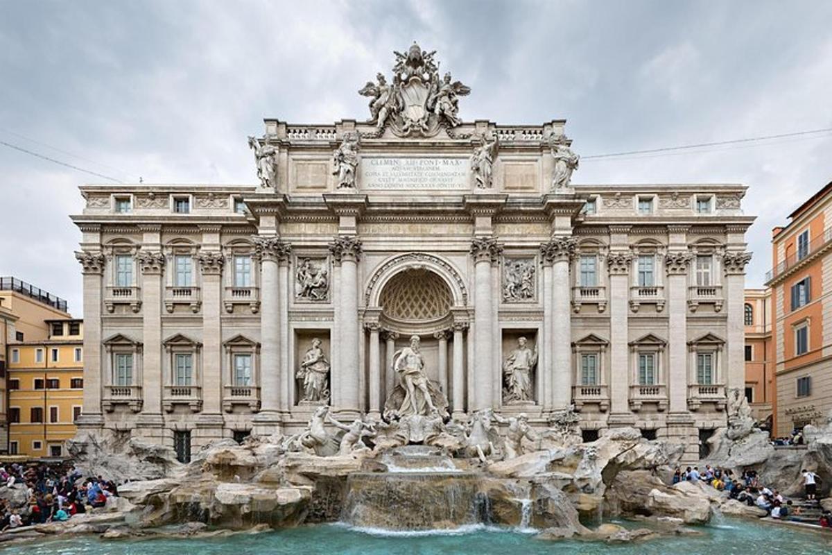 a large building with a fountain in front of it