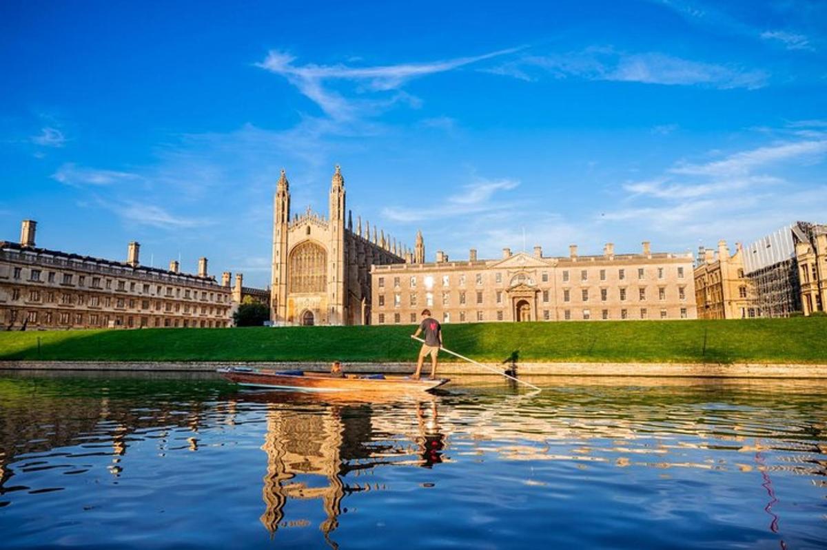 a man is rowing a boat in front of a building