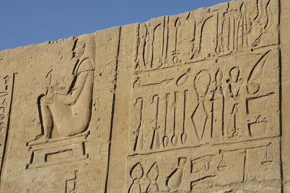 a sand sculpture of aaraoh on the side of a building