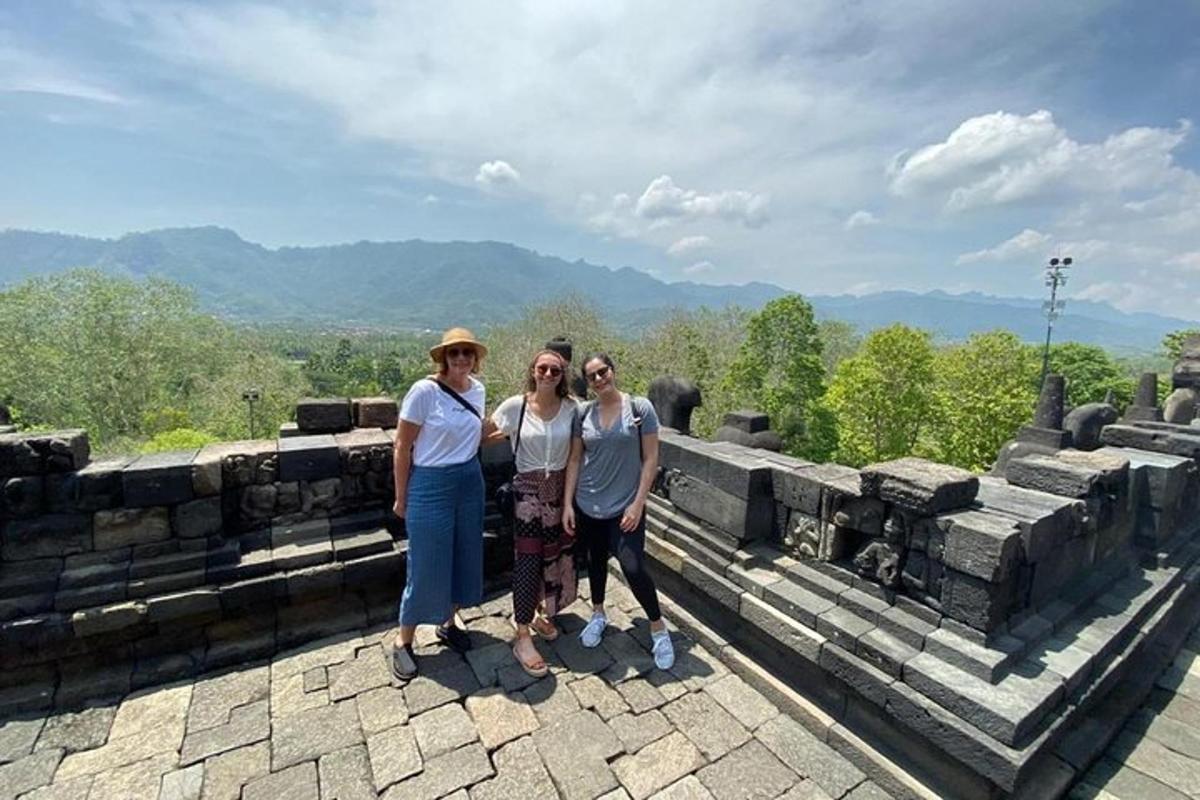a group of people standing on top of a temple