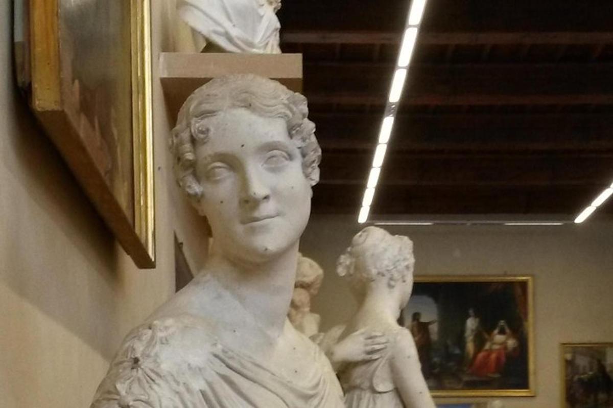 a statue of a woman in a museum