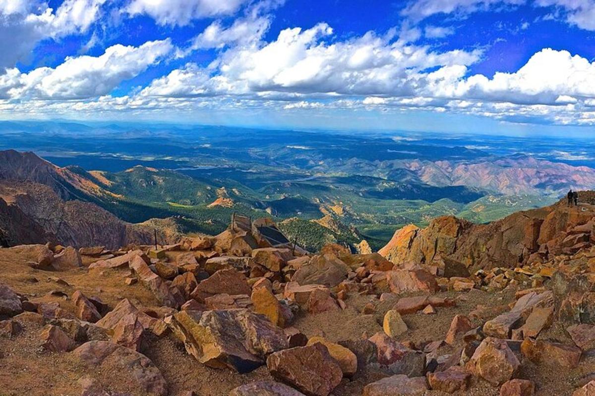 a view from the top of a mountain with rocks