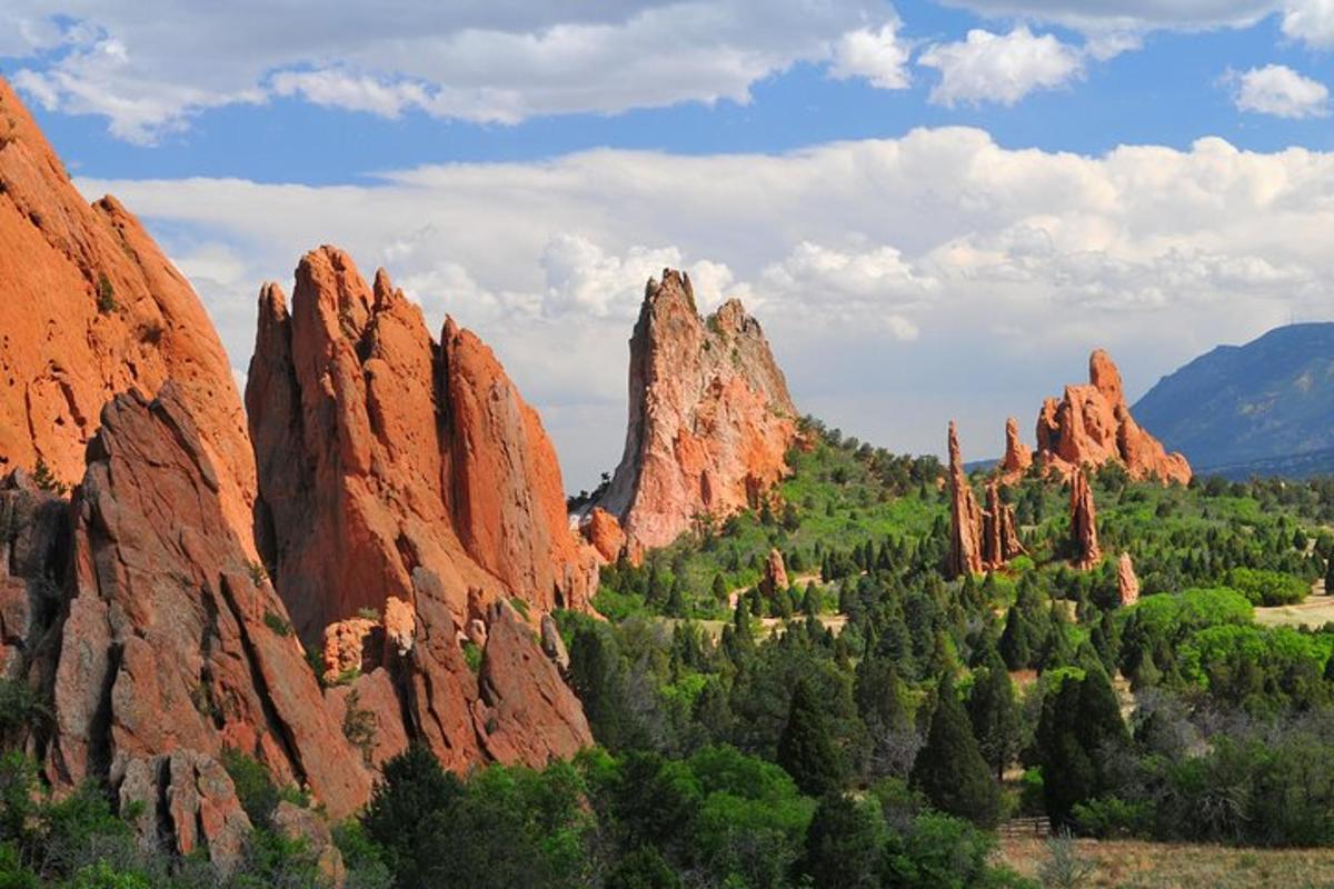 a view of a canyon with tall red rocks