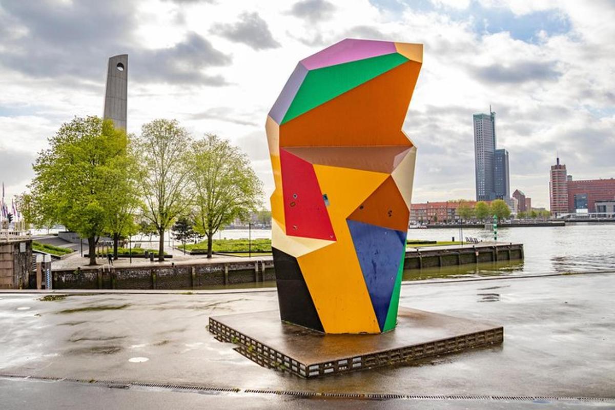 a colorful sculpture in a park near a river